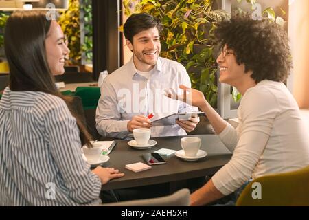 Millennial business partners discussing new startup project Stock Photo