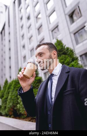 Concentrated bearded businessman being deep in thoughts Stock Photo