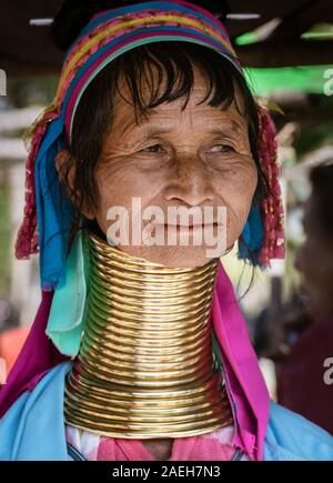 Portrait of an eldery woman from Kayan tribe wearing traditional outfit and brass neck rings in Pan Pet village, Loikaw, Myanmar. Stock Photo