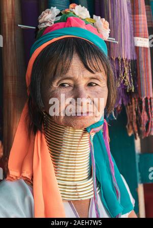 Portrait of an eldery woman from Kayan tribe wearing traditional outfit and brass neck rings in Pan Pet village, Loikaw, Myanmar. Stock Photo