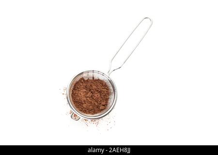 Strainer with cocoa powder isolated on white background Stock Photo
