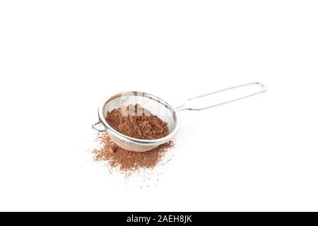 Strainer with cocoa powder isolated on white background Stock Photo