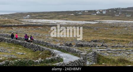 Tourists at prehistoric Fort of Dun Aonghasa, Kilronan, Inishmore, Aran Islands, County Galway, Republic of Ireland Stock Photo