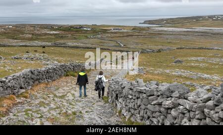 Tourists at prehistoric Fort of Dun Aonghasa, Kilronan, Inishmore, Aran Islands, County Galway, Republic of Ireland Stock Photo