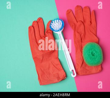 Premium Photo  Items for home cleaning: green rubber gloves, brush,  multi-colored sponges for dusting