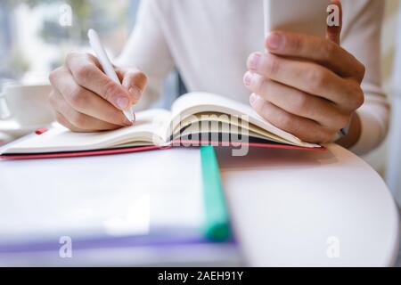 Close up of male hands that making notes Stock Photo