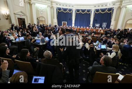 United States Capitol police officers remove a yelling supporter of U.S. President Donald Trump as he screams criticism at House Judiciary Committee Chairman Rep. Jerrold Nadler at the start of a US House Judiciary Committee hearing to receive counsel presentations of evidence from the impeachment inquiry into US President Donald J. Trump on Capitol Hill in Washington, U.S., December 9, 2019. Credit: Jonathan Ernst / Pool via CNP /MediaPunch Stock Photo