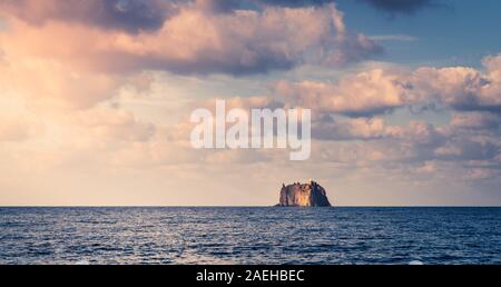 Small island with a lighthouse near Stromboli Island Stock Photo