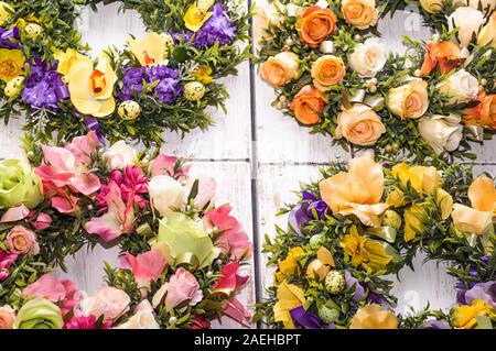 Background for easter, card with eggs and flowers on white table, home decor Stock Photo