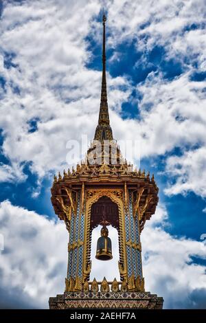 Bangkok, Thailand 11.24.2019: A Thai traditional bell tower (belfry) with detailed, mosaic artwork and gold colored design at Wat Phra Kaew (Temple of