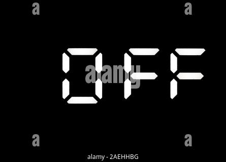 Real white led digital clock on a black background showing OFF Stock Photo