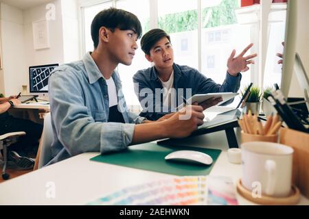 Programmer and UX UI designer working in a software development and coding technologies. Mobile and website design and programing development technolo Stock Photo