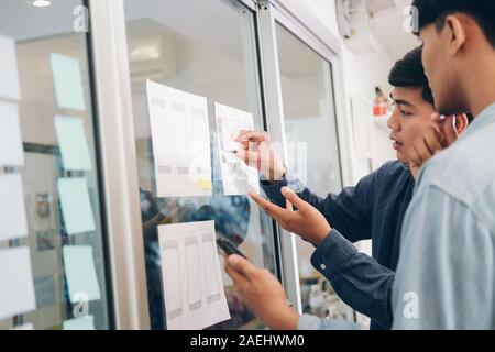 Programmer and UX UI designer working in a software development and coding technologies. Mobile and website design and programing development technolo Stock Photo
