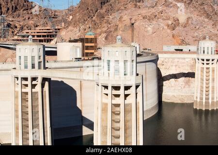 Intake towers for the hydro plant on the Hoover Dam, Lake Mead, Nevada, USA. The lake is at a very low level due to the four year long drought. Stock Photo