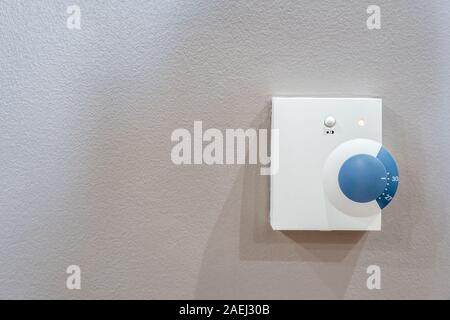 Temperature control knob, air conditioner in room Stock Photo