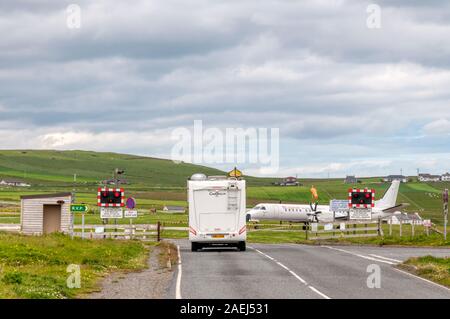 Road closed for taxiing aircraft at Sumburgh Airport, Shetland. Stock Photo