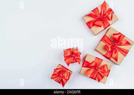 Frame of cardboard gift boxes with red bows. Stock Photo