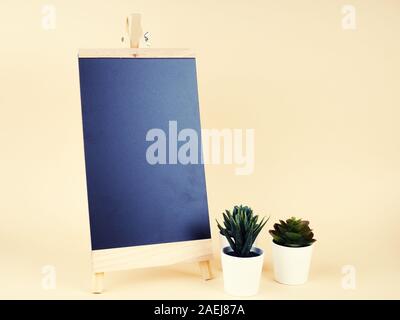 Space of black board background with cactus decorate. On wood background Stock Photo