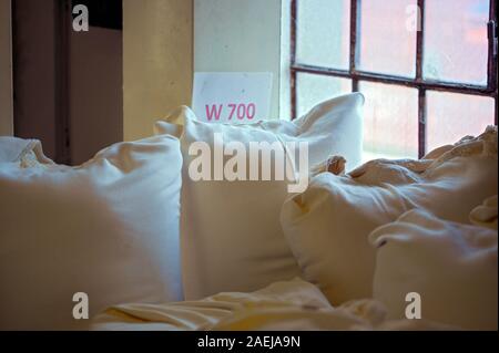 wheat flour of the type 700 in white fabric bags in a grain mill Stock Photo