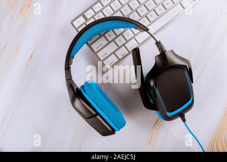 Call center, client services or online support, headset lying on a computer keyboard of telemarketing Stock Photo
