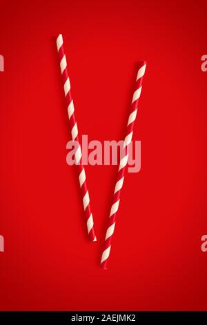 Christmas cocktail straws on a red background Stock Photo