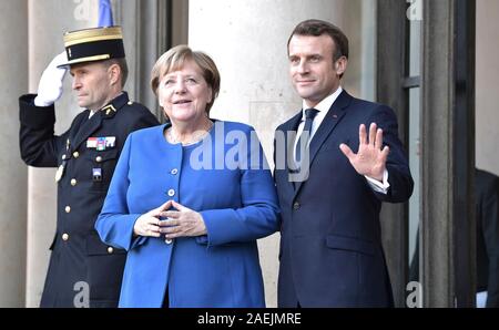 Paris, France. 09th Dec, 2019. French President Emmanuel Macron welcomes German Chancellor Angela Merkel to the Elysee Palace December 9, 2019 in Paris, France. Merkel is in Paris for the Normandy Format Summit in an effort to find an end to the war in Ukraine. Credit: Alexei Nikolsky/Kremlin Pool/Alamy Live News