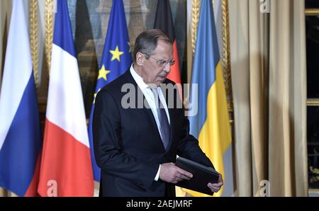 Paris, France. 09th Dec, 2019. Russia Foreign Minister Sergey Lavrov takes his place for the start of the Normandy Format Summit meeting at the Elysee Palace December 9, 2019 in Paris, France. The summit is hosted by French President Emmanuel Macron and German Chancellor Angela Merkel in an effort to find an end to the war in Ukraine. Credit: Alexei Nikolsky/Kremlin Pool/Alamy Live News