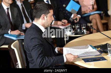 Paris, France. 09th Dec, 2019. Ukrainian President Vladimir Zelensky prepares for the start of the Normandy Format Summit meeting at the Elysee Palace December 9, 2019 in Paris, France. The summit is attended hosted by French President Emmanuel Macron and German Chancellor Angela Merkel in an effort to find an end to the war in Ukraine. Credit: Alexei Nikolsky/Kremlin Pool/Alamy Live News