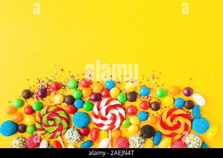 Download Colorful Candies Over Yellow Background Top View Flat Lay Copy Space Sweet Mix For Birthday Or Candy Shop Stock Photo Alamy PSD Mockup Templates