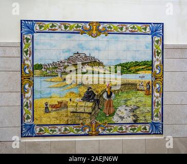 Detail of the beautiful polychromatic ceramic tiles panel depicting the farming life along the river, on a wall in Tentugal, Coimbra, Portugal Stock Photo