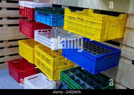 Colored vegetable boxes plastic on stand. Agriculture Stock Photo