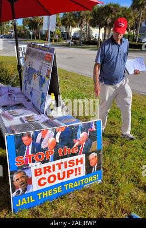 Melbourne Beach, Florida. USA. December 9, 2019, Out of state, LaRouche  PAC group sets up information tables and tent with home-made signs in front of the Melbourne Beach Post Office to spread their message and collect petition signatures in support of President Trump.  Photo Credit Julian Leek / Alamy Live News Stock Photo