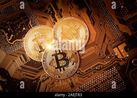 Bitcoin cryptocurrency, virtual money, blockchain technology. Coin on circuit board as microprocessor concept. Stock Photo