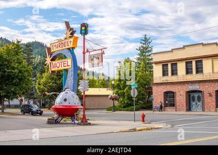 A vintage roadside sign with miniature spaceship in front of a motel in the historic city of Wallace, Idaho. Stock Photo