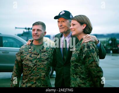 Actor and Director Clint Eastwood, center, poses with U.S. Marine Corps Maj. Matthew Hilton, left, and Master Sgt. Kristin Bagley, following an advanced showing of Eastwoods latest movie at Marine Corps Air Station Camp Pendleton December 7, 2019 in Oceanside, California.