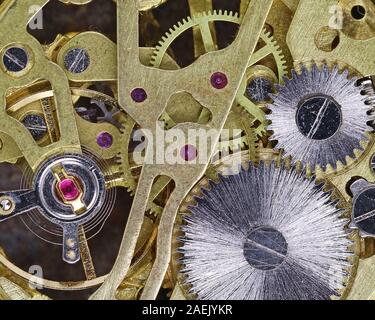 top view gears of a golden mechanical pocket watch, mechanism of a clock Stock Photo