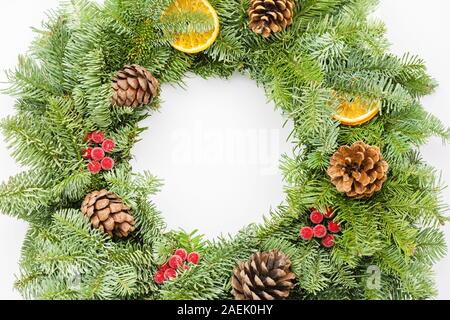 Top view of handmade Christmas wreath on white table, selective focus Stock Photo