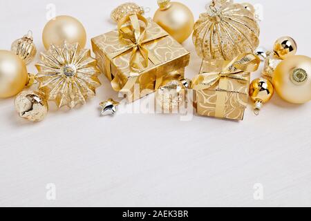 Christmas gift boxes with Christmas balls on white background Stock Photo