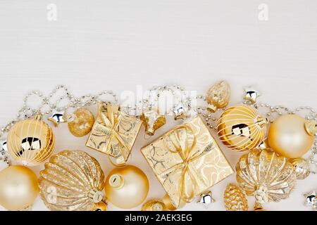 Christmas gift boxes with Christmas balls on white background Stock Photo