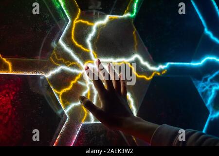 Woman touching plasma panel display Stock Photo