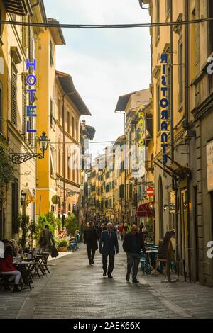 Street view of Via Faenza in the San Lorenzo district, historic centre of Florence, with people and tourists in sidewalk café, Tuscany, Italy Stock Photo