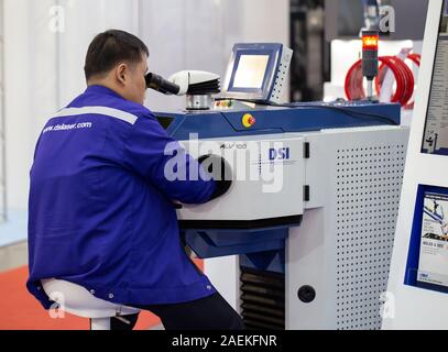 Bangkok, Thailand - November 22, 2019: Technician demonstrate pulse laser welding in Metalex 2019 Stock Photo