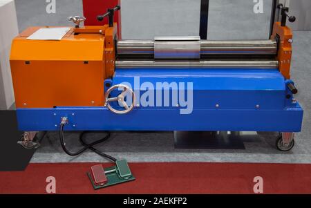 Manual metal sheet roll forming machine, Industrial machinery Stock Photo