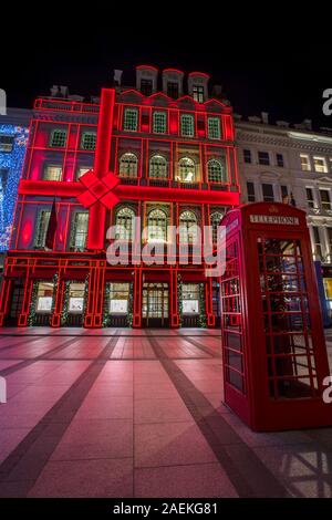 London, UK - December 9th 2019: The festive exterior of the Cartier store during Christmas, on New Bond Street in London, UK. Stock Photo