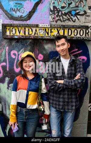 Informal portrait of young tourist couple photographed in Hosier Lane, Melbourne,  Australia. Stock Photo