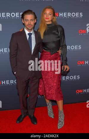 NEW YORK, NY - DECEMBER 08: Tom Payne and Jennifer Akerman attend the 13th Annual CNN Heroes at the American Museum of Natural History on December 08, Stock Photo