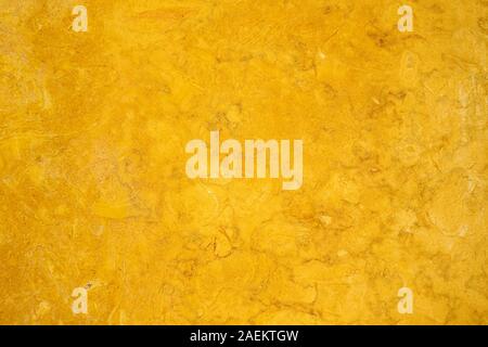 Goldern marbled rock flat smooth surface background Stock Photo