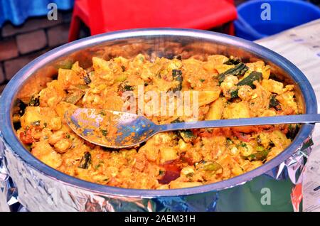 Homemade India food :'Aloo Gobhi' or know as Spiced Potatoes with Cauliflower is main ingredient cook with the dried onion seeds in ground masala past Stock Photo