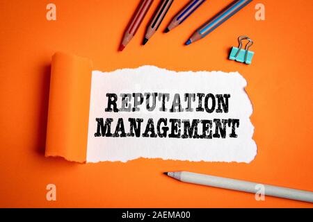 Reputation Management. Trust, brand and marketing. Text under torn paper Stock Photo