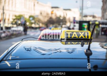 Taxi car cab somewhere on the street waiting for a passenger. Stock Photo